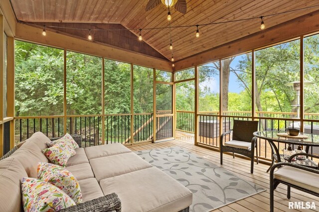 27998 229th St, Le Claire, IA 52753 - sunroom featuring an outdoor hangout area, lofted ceiling, rail lighting, and healthy amount of natural light