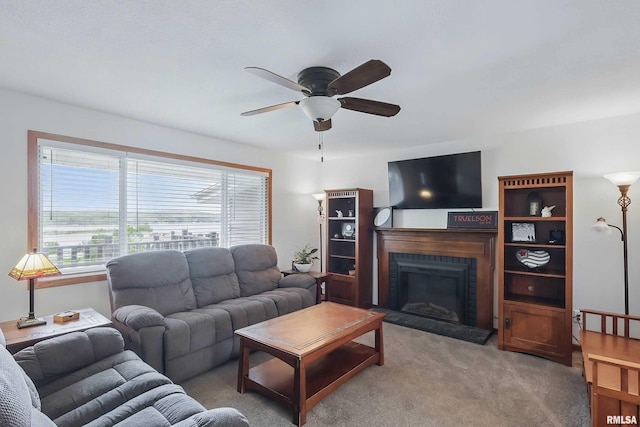 21704 283rd Ave, Le Claire, IA 52753 - living room with healthy amount of natural light, a ceiling fan, light carpet, and a fireplace with raised hearth