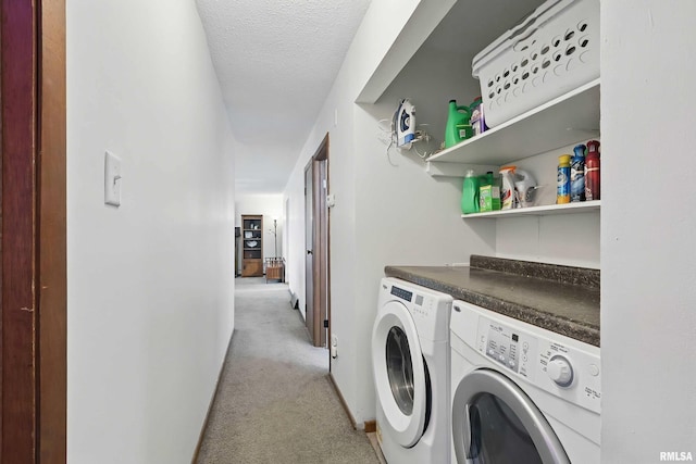 21704 283rd Ave, Le Claire, IA 52753 - laundry room featuring separate washer and dryer, light colored carpet, a textured ceiling, and baseboards
