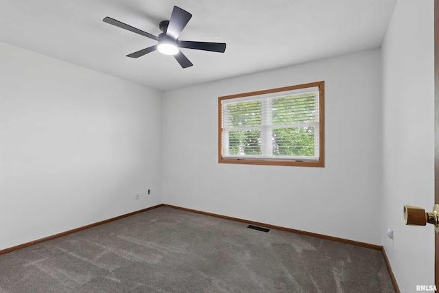 21704 283rd Ave, Le Claire, IA 52753 - unfurnished room with carpet flooring, ceiling fan, and baseboards