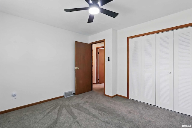 21704 283rd Ave, Le Claire, IA 52753 - unfurnished bedroom with carpet, baseboards, a closet, and ceiling fan