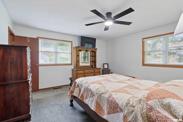 21704 283rd Ave, Le Claire, IA 52753 - bedroom featuring carpet, ceiling fan, and baseboards