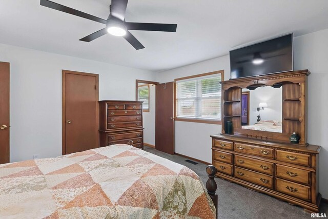 21704 283rd Ave, Le Claire, IA 52753 - bedroom featuring carpet floors, ceiling fan, and baseboards
