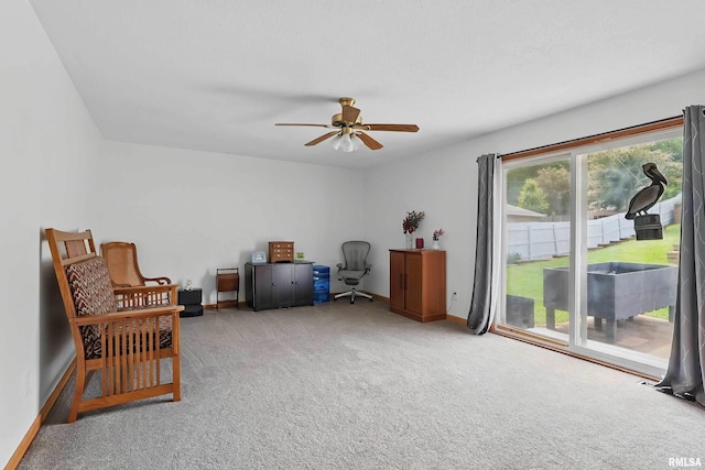 21704 283rd Ave, Le Claire, IA 52753 - living area featuring carpet flooring, a ceiling fan, and baseboards