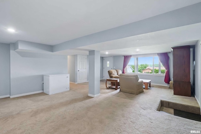 21704 283rd Ave, Le Claire, IA 52753 - basement featuring carpet flooring, baseboards, recessed lighting, and white refrigerator