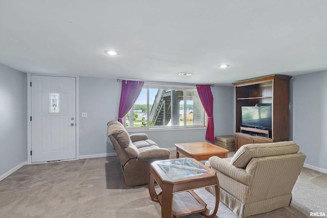 21704 283rd Ave, Le Claire, IA 52753 - living room with baseboards, light colored carpet, and recessed lighting