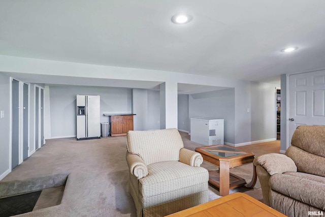 21704 283rd Ave, Le Claire, IA 52753 - living room featuring baseboards, light carpet, and recessed lighting