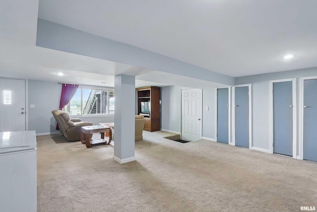 21704 283rd Ave, Le Claire, IA 52753 - living area with baseboards, carpet flooring, and recessed lighting