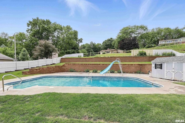 21704 283rd Ave, Le Claire, IA 52753 - view of swimming pool featuring a water slide and view of wooded area