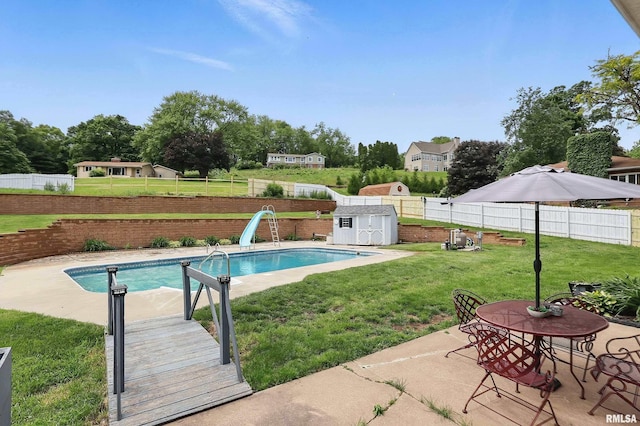 21704 283rd Ave, Le Claire, IA 52753 - view of swimming pool featuring a water slide and a patio