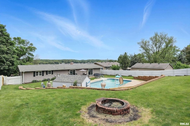 21704 283rd Ave, Le Claire, IA 52753 - rear view of house featuring an outdoor fire pit