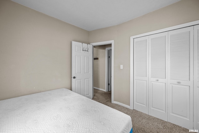 3610 12th Ave, Moline, IL 61265 - bedroom featuring carpet, a closet, and baseboards