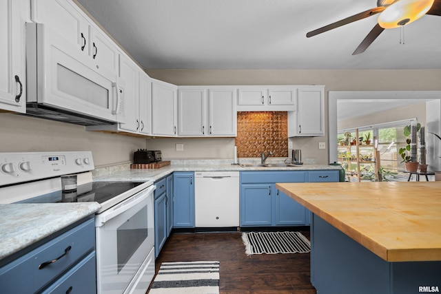 3610 12th Ave, Moline, IL 61265 - kitchen featuring white appliances, blue cabinets, a sink, wood counters, and dark wood finished floors