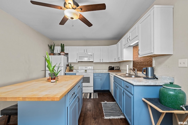 3610 12th Ave, Moline, IL 61265 - kitchen with white appliances, blue cabinetry, wooden counters, a sink, and a ceiling fan