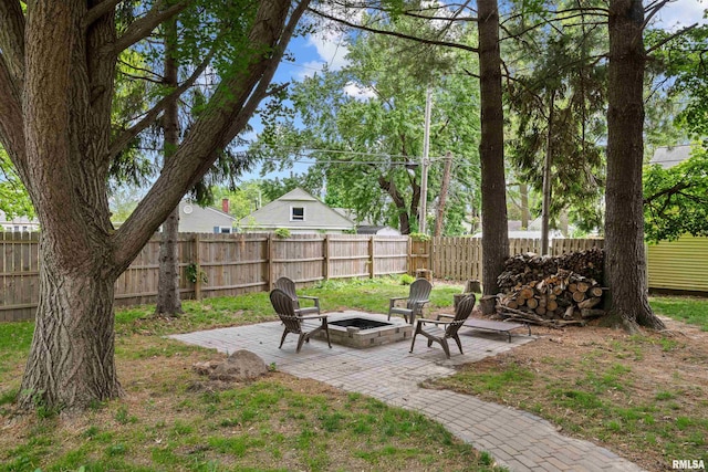 3610 12th Ave, Moline, IL 61265 - fenced backyard with an outdoor fire pit and a patio area