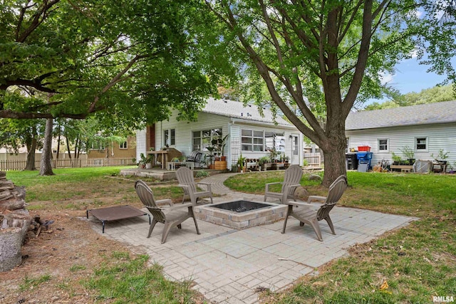 3610 12th Ave, Moline, IL 61265 - view of patio featuring an outdoor fire pit
