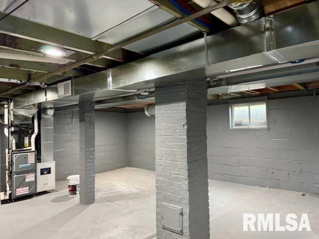 1203 13th Ave S, Clinton, IA 52732 - basement with heating unit