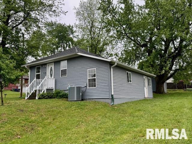 1203 13th Ave S, Clinton, IA 52732 - rear view of property with central AC and a lawn