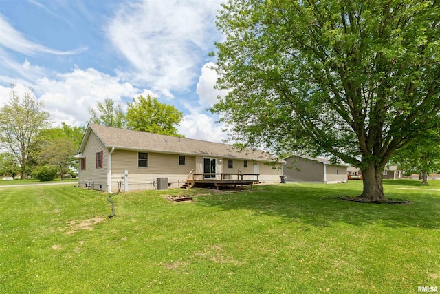 301 5th St, Matherville, IL 61263 - back of house featuring a wooden deck, a yard, and central air condition unit