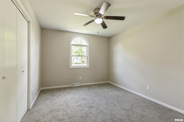 301 5th St, Matherville, IL 61263 - carpeted empty room with baseboards, ceiling fan, and a textured ceiling