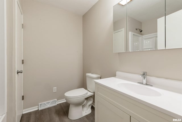 301 5th St, Matherville, IL 61263 - full bath with wood finished floors, vanity, toilet, baseboards, and a shower
