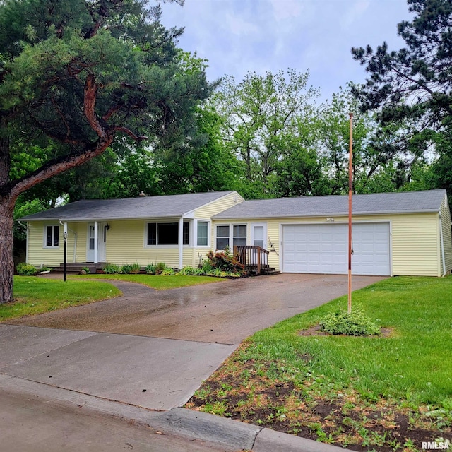 2727 32nd Avenue Ct, Rock Island, IL 61201 - single story home featuring asphalt driveway, a front yard, and a garage