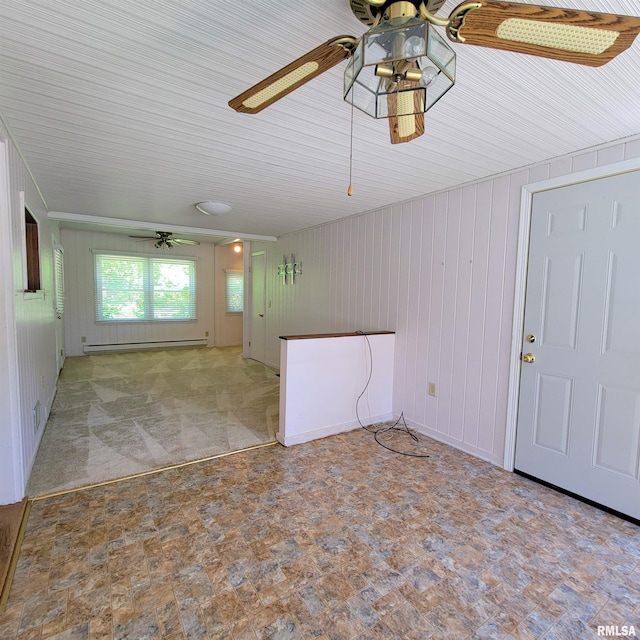 2727 32nd Avenue Ct, Rock Island, IL 61201 - unfurnished living room with a baseboard heating unit, a ceiling fan, and wooden walls