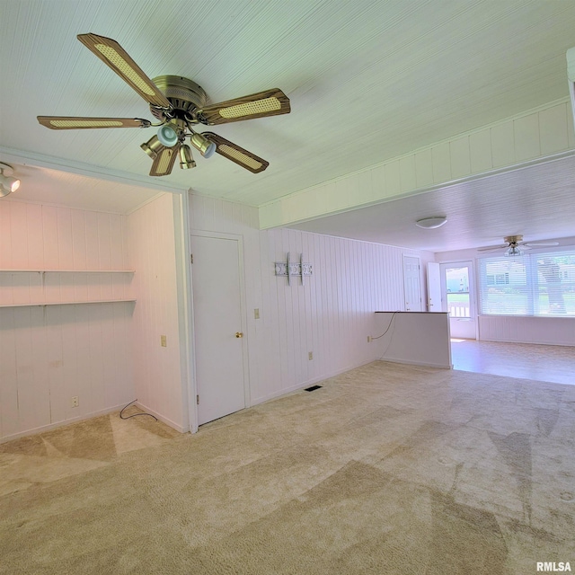 2727 32nd Avenue Ct, Rock Island, IL 61201 - carpeted empty room featuring ceiling fan and wooden walls