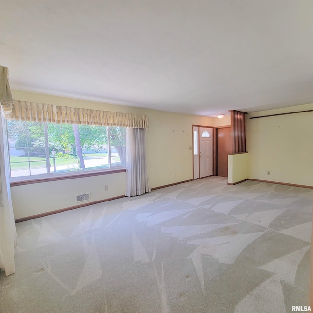 2727 32nd Avenue Ct, Rock Island, IL 61201 - empty room with plenty of natural light, carpet, and baseboards