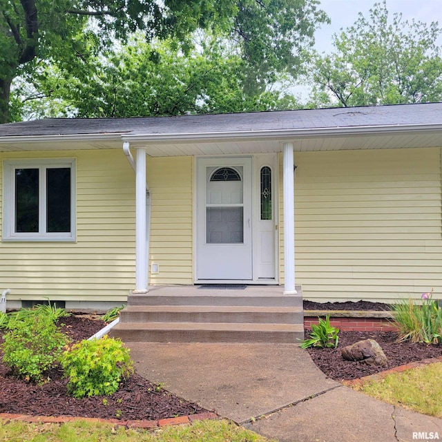 2727 32nd Avenue Ct, Rock Island, IL 61201 - view of exterior entry featuring a porch and roof with shingles