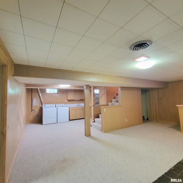 2727 32nd Avenue Ct, Rock Island, IL 61201 - below grade area featuring wooden walls, stairway, carpet, and washer and clothes dryer