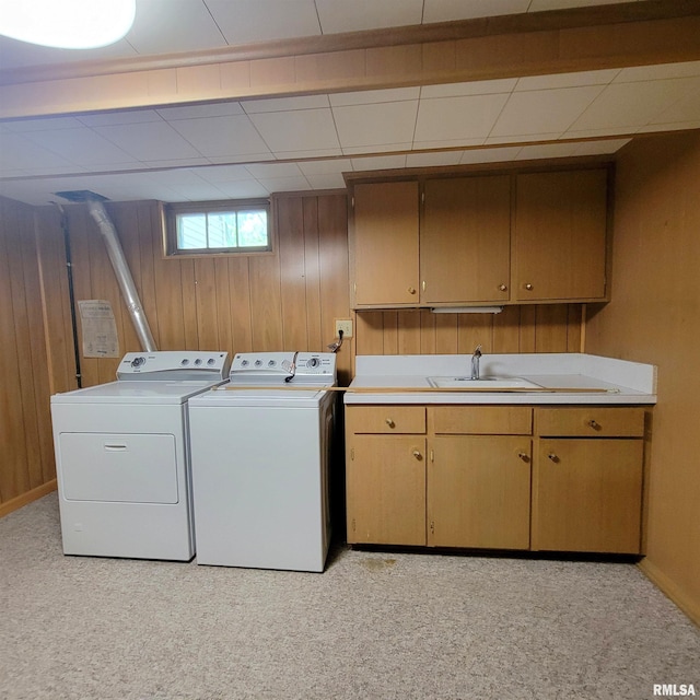 2727 32nd Avenue Ct, Rock Island, IL 61201 - washroom with washer and dryer, wooden walls, cabinet space, baseboards, and light colored carpet