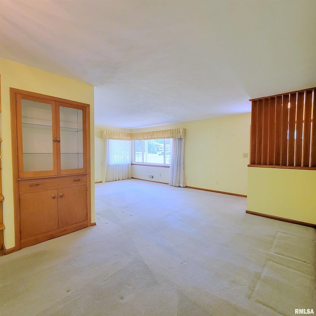 2727 32nd Avenue Ct, Rock Island, IL 61201 - spare room featuring light carpet and baseboards