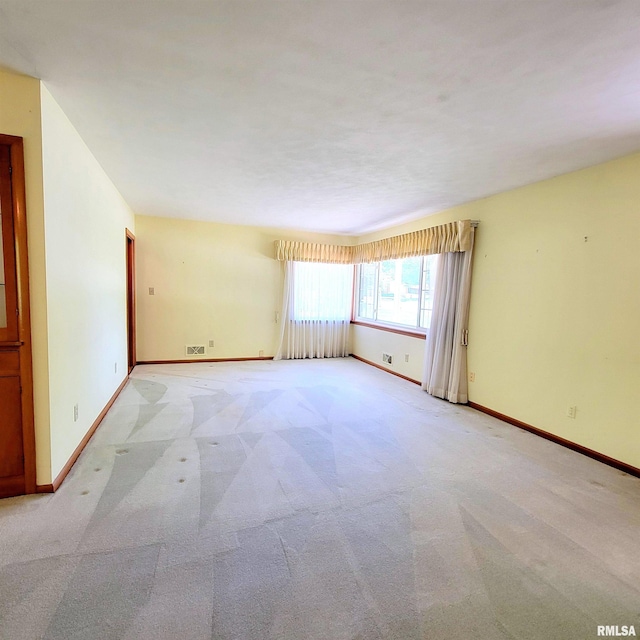 2727 32nd Avenue Ct, Rock Island, IL 61201 - unfurnished room featuring light carpet and baseboards