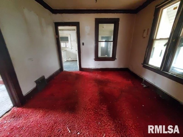 2327 7th St, Rock Island, IL 61201 - carpeted empty room with baseboards and ornamental molding