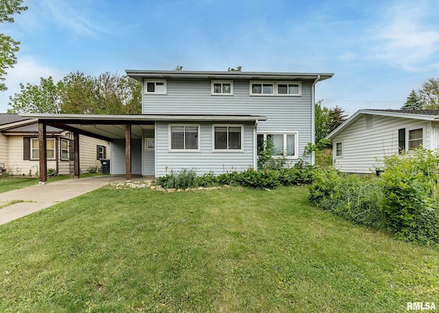 2908 N 4th St, Clinton, IA 52732 - back of property with concrete driveway, a carport, and a lawn