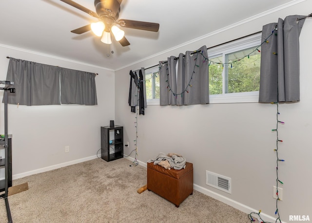 2908 N 4th St, Clinton, IA 52732 - carpeted bedroom featuring baseboards, ornamental molding, and ceiling fan