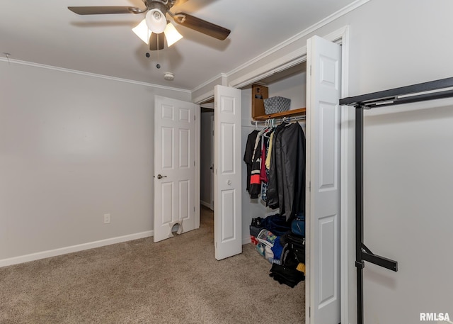 2908 N 4th St, Clinton, IA 52732 - carpeted bedroom with crown molding, a ceiling fan, and baseboards