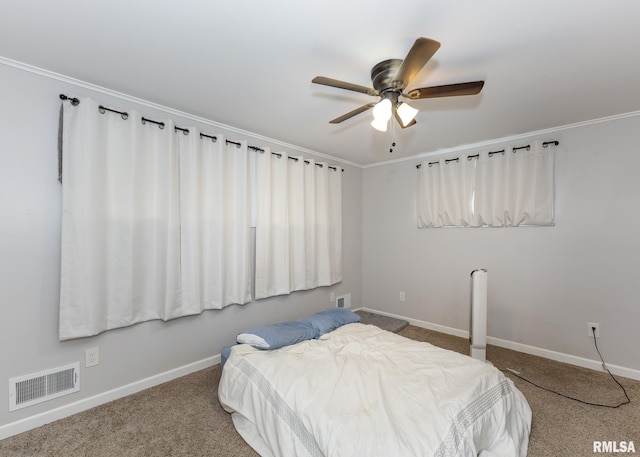2908 N 4th St, Clinton, IA 52732 - carpeted bedroom with baseboards, crown molding, and ceiling fan