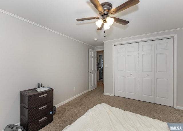 2908 N 4th St, Clinton, IA 52732 - bedroom featuring carpet, crown molding, baseboards, a ceiling fan, and a closet