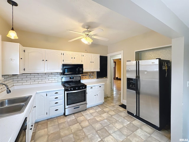 308 E Central Park Ave, Davenport, IA 52803 - kitchen with appliances with stainless steel finishes, a sink, tasteful backsplash, a ceiling fan, and white cabinets