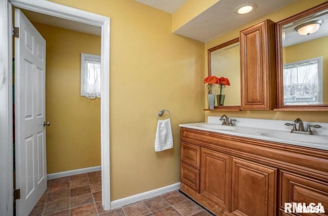 109 W 6th St, Wilton, IA 52778 - full bathroom with double vanity and baseboards
