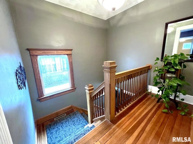 109 W 6th St, Wilton, IA 52778 - staircase featuring healthy amount of natural light, wood finished floors, and baseboards