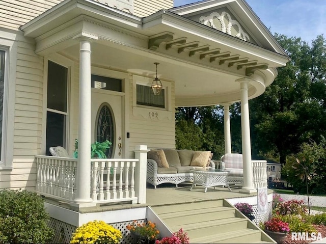 109 W 6th St, Wilton, IA 52778 - wooden porch featuring outdoor lounge area