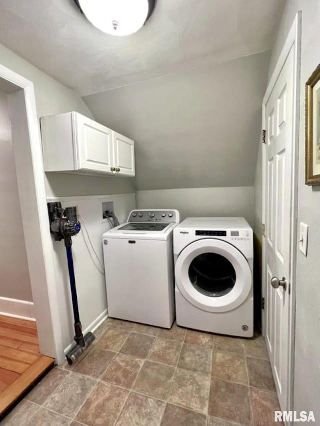 109 W 6th St, Wilton, IA 52778 - laundry area with independent washer and dryer, cabinet space, light stone finish flooring, and baseboards