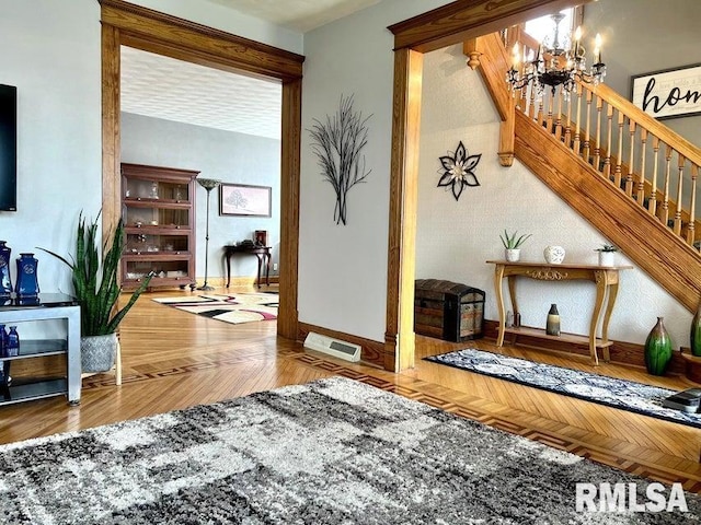 109 W 6th St, Wilton, IA 52778 - living area with a chandelier, stairway, and baseboards