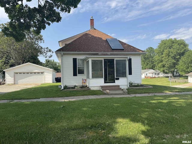 111 NE 5th St, Aledo, IL 61231 - bungalow with entry steps, a garage, an outbuilding, a chimney, and a front lawn