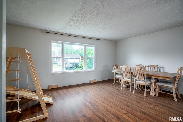 1656 Hitching Post Ln, Davenport, IA 52806 - dining space featuring wood finished floors and a textured ceiling