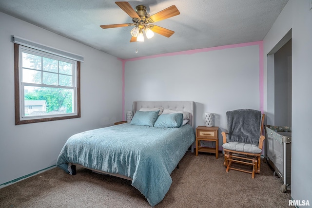 1656 Hitching Post Ln, Davenport, IA 52806 - bedroom with carpet flooring, ceiling fan, and a textured ceiling