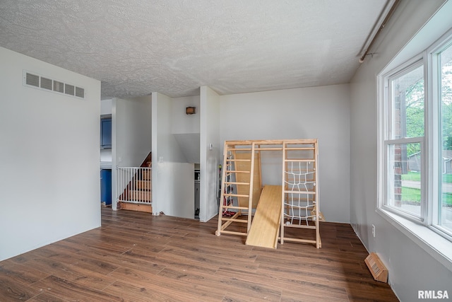 1656 Hitching Post Ln, Davenport, IA 52806 - empty room featuring wood finished floors and a textured ceiling